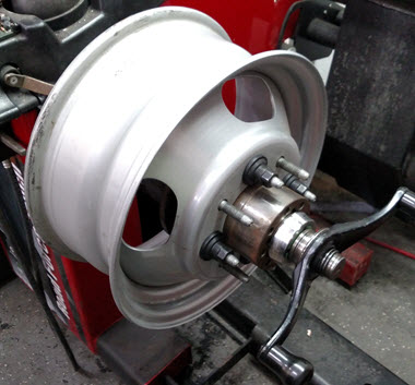 Road force mounted with hub and 4 lug nuts