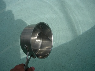 Obtain a sample of your pool water in a small cooking pot